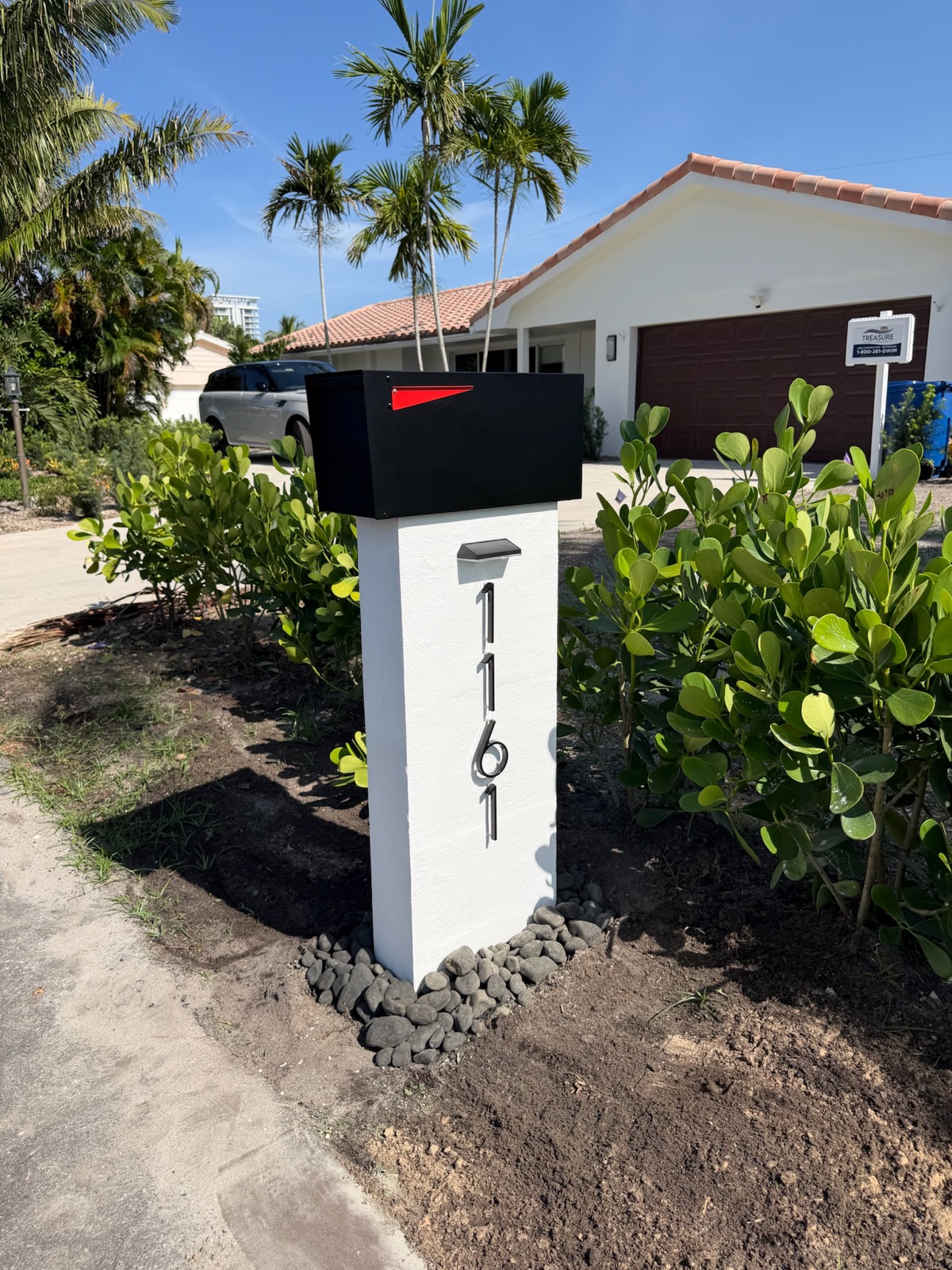 Matching custom mailboxes along the curb of a newly built Florida community
