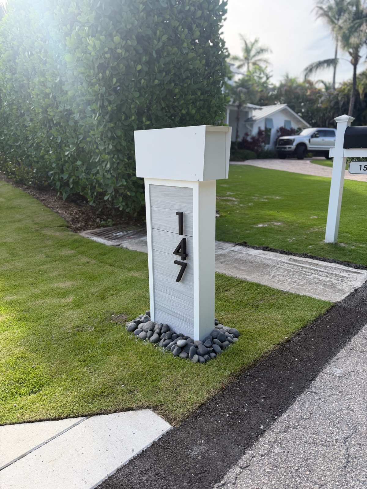Matching custom mailboxes along a residential street in a community association
