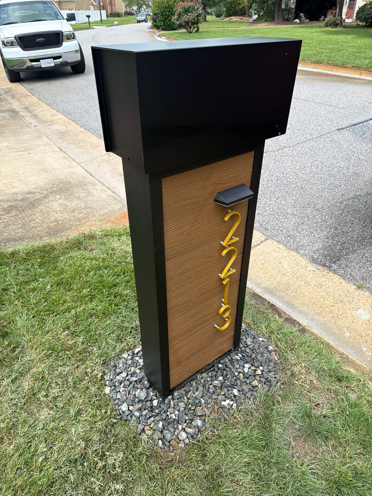 Mailboxes and posts along a community street during a site walk