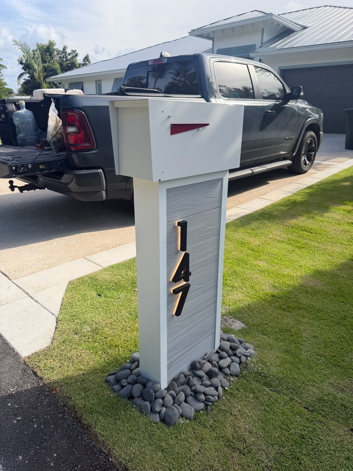 Matching custom mailboxes lining a residential street in an HOA community