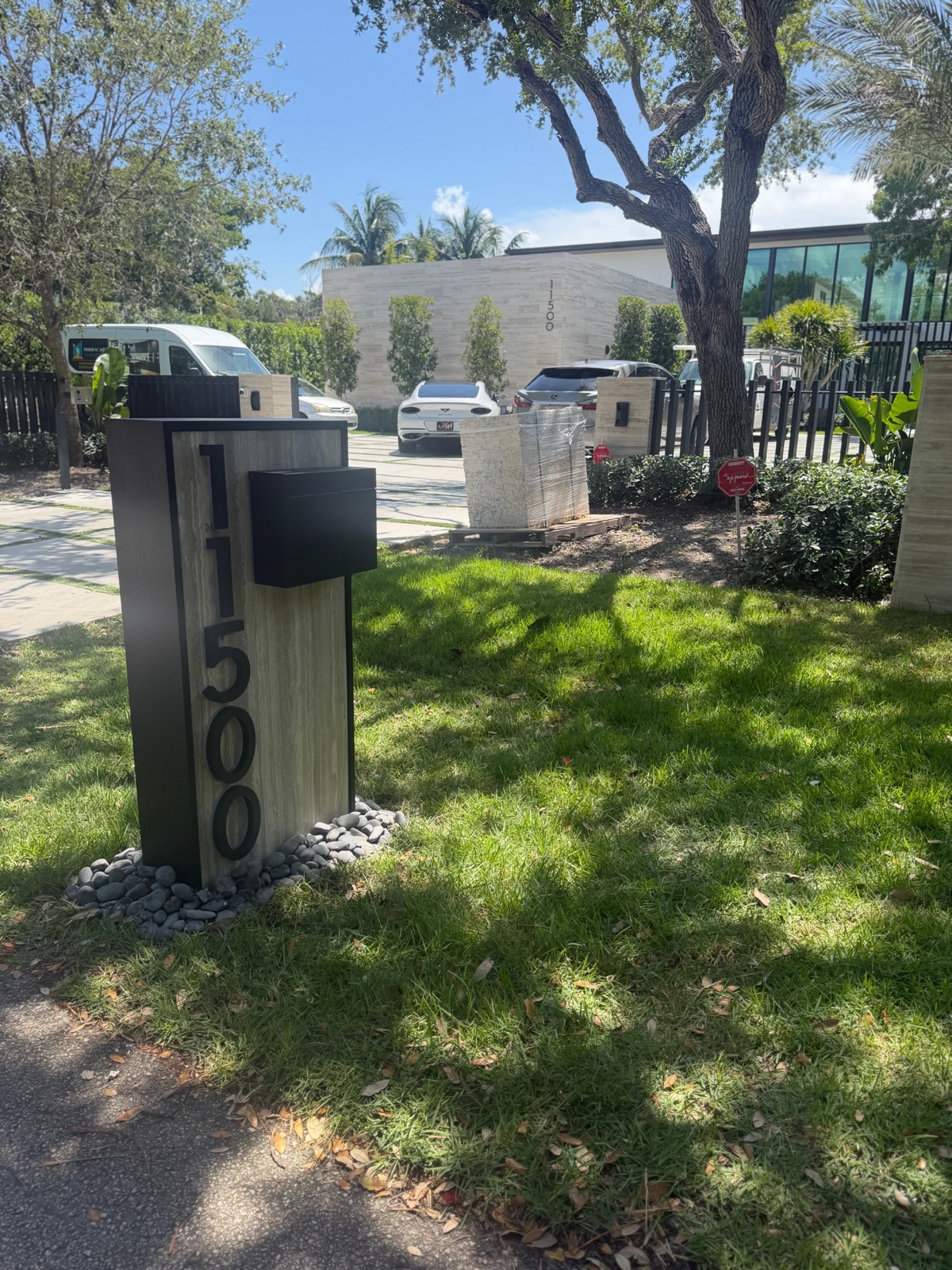 A row of matching community mailboxes with consistent finish and number size