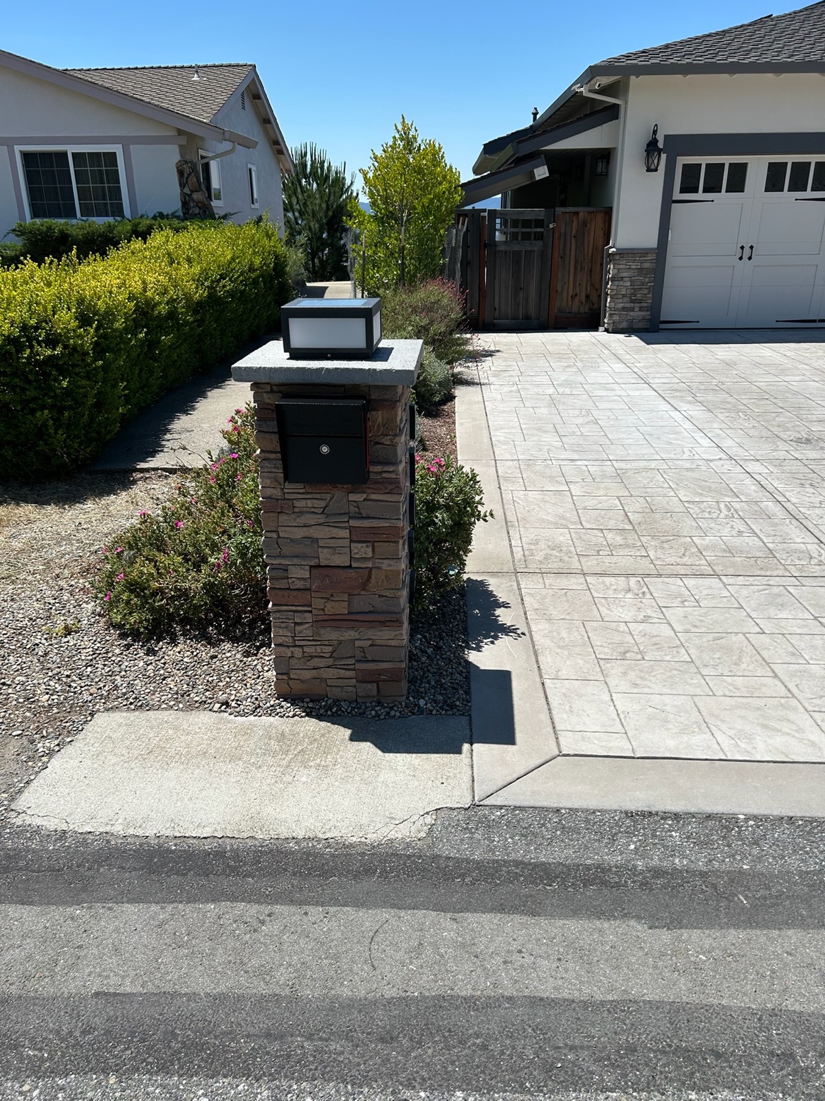 A design mockup of a custom mailbox showing color, numerals, and post style before fabrication