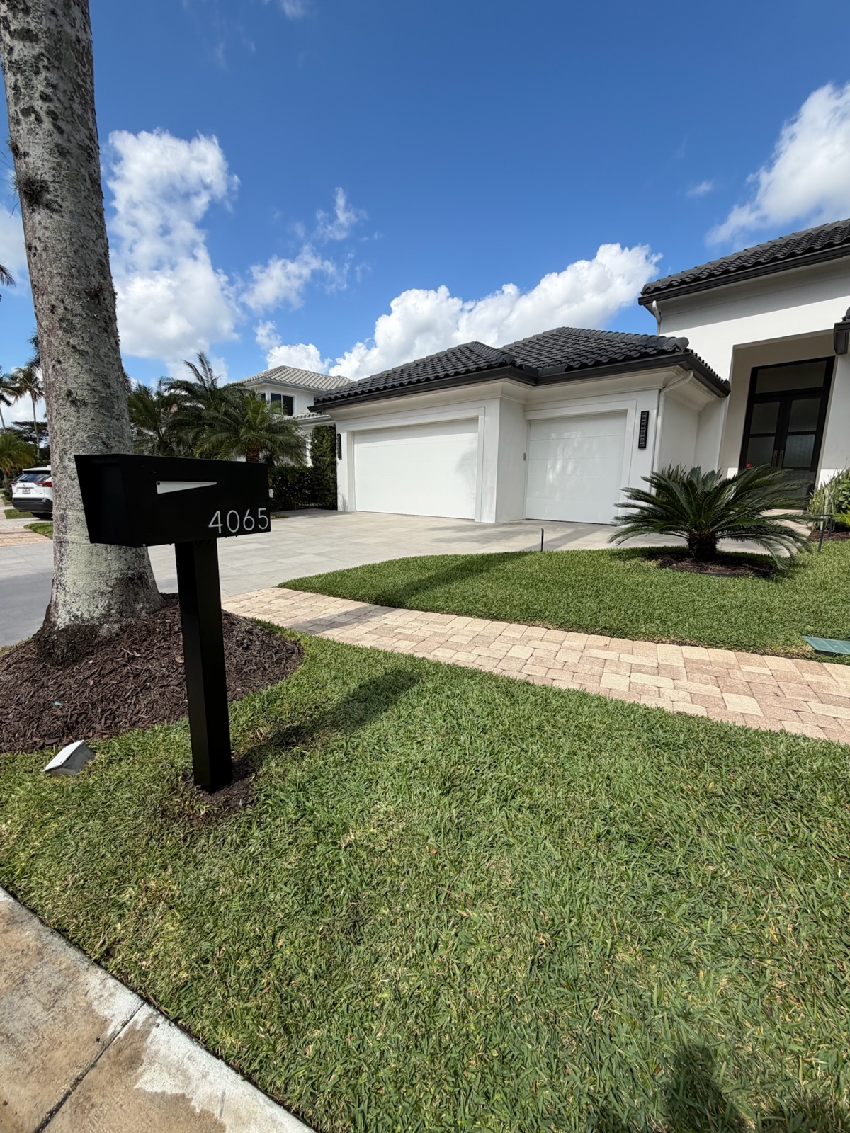 Matching custom mailboxes lining a residential street in a planned community