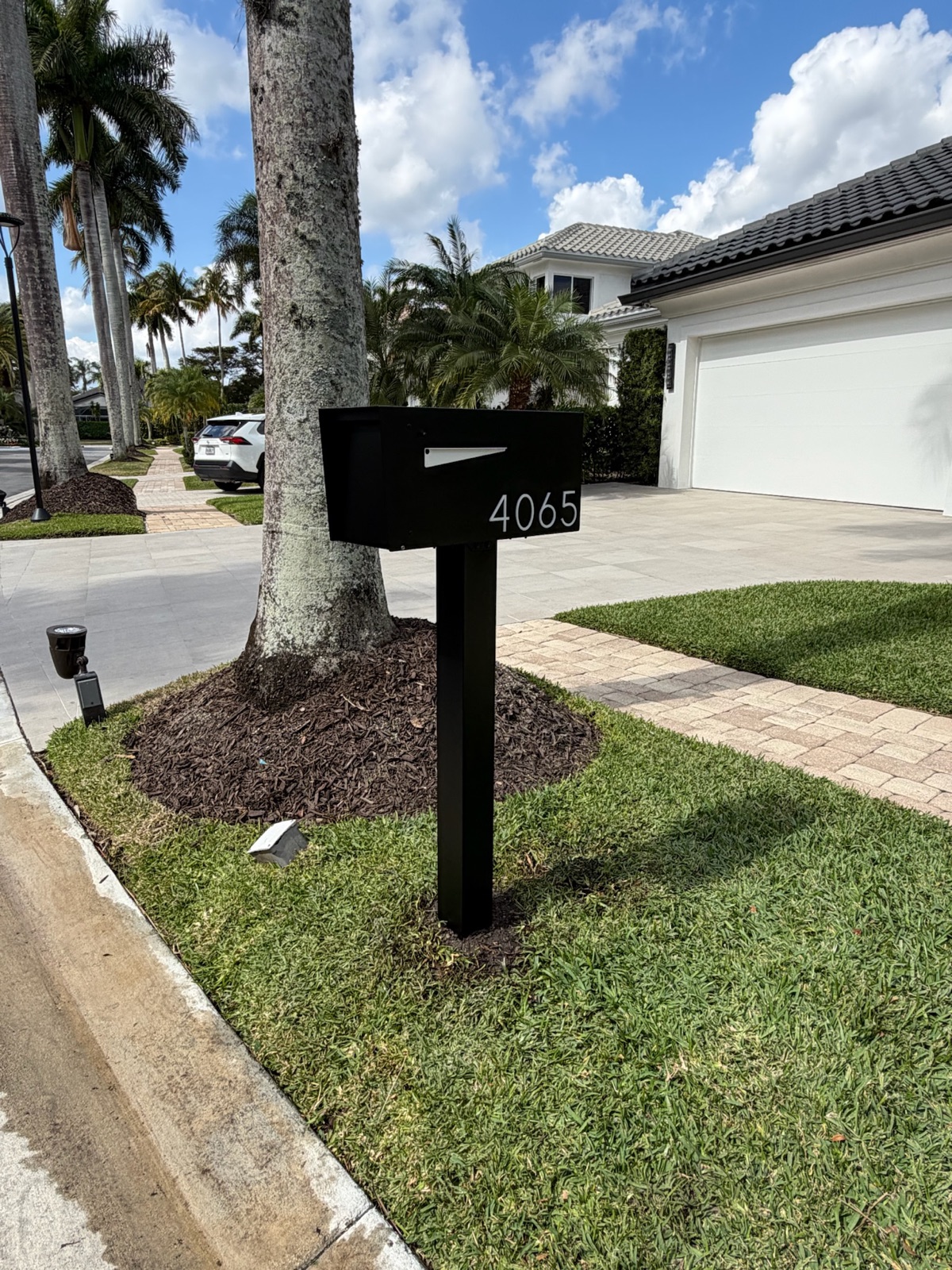 A design mockup of a community mailbox standard showing finish, post style, and address numbers