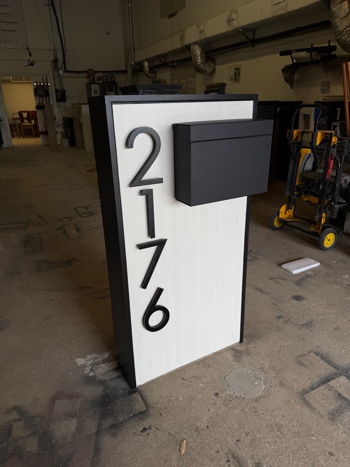 A black locking package vault with the retrieval door, sized to hold several days of parcels