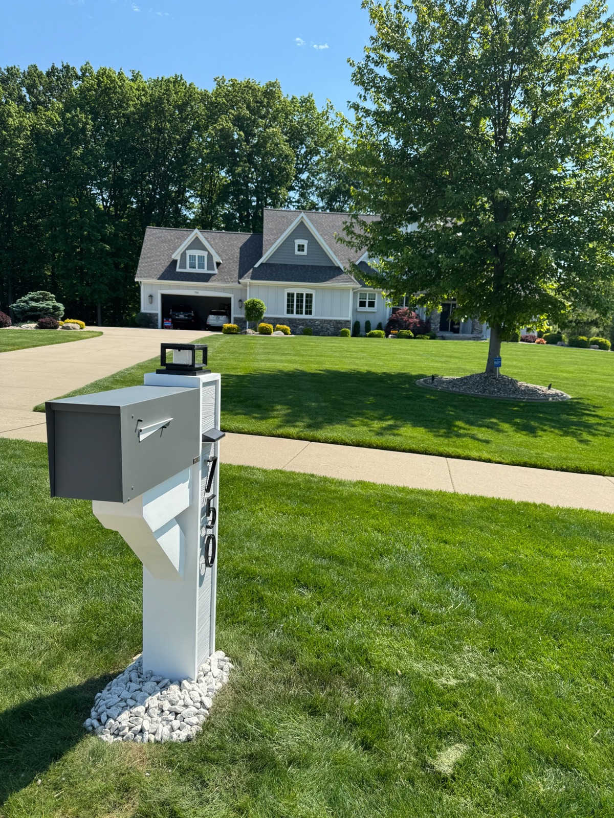 A Slatline aluminum mailbox with a white frame, a modern option for Atlanta-area curbs
