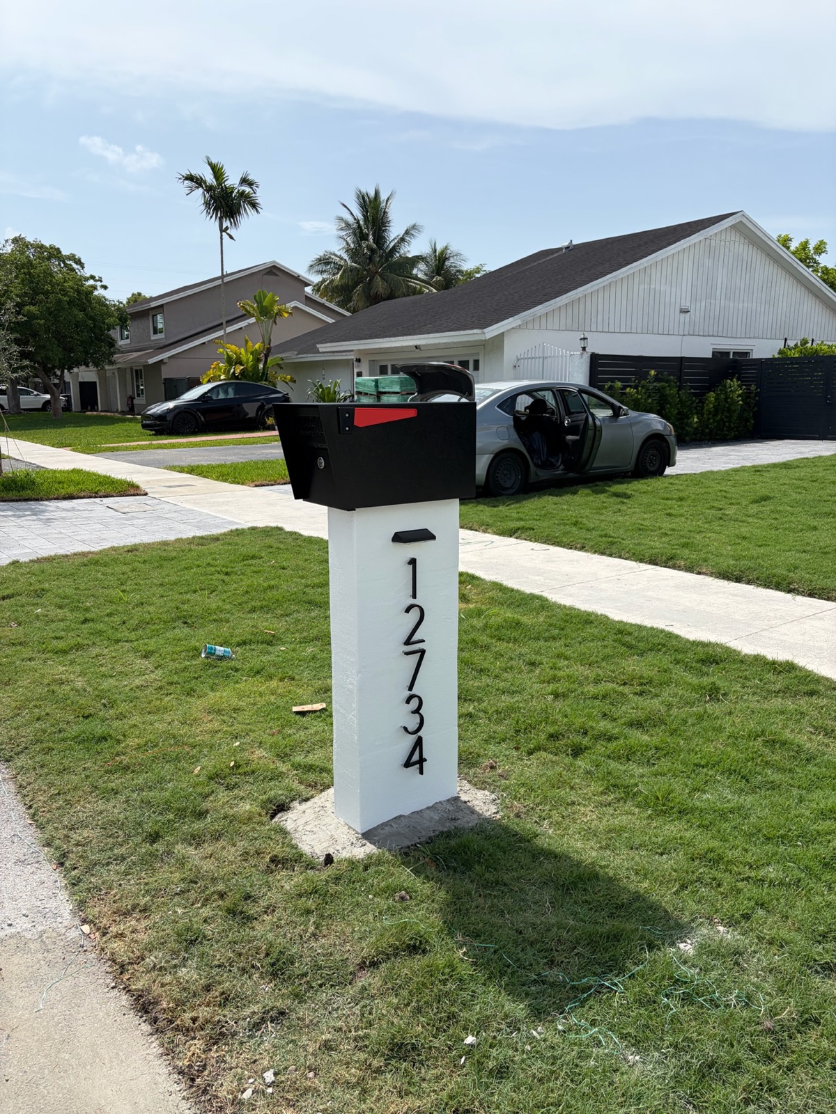 A walnut Modern Farmhouse composite mailbox, one of the custom builds available for DFW installs