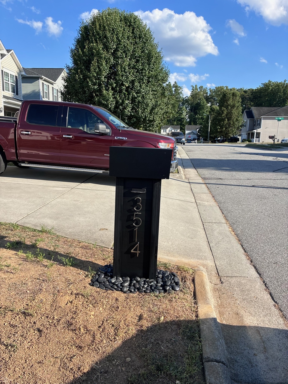 A community mailbox install in progress along a residential street
